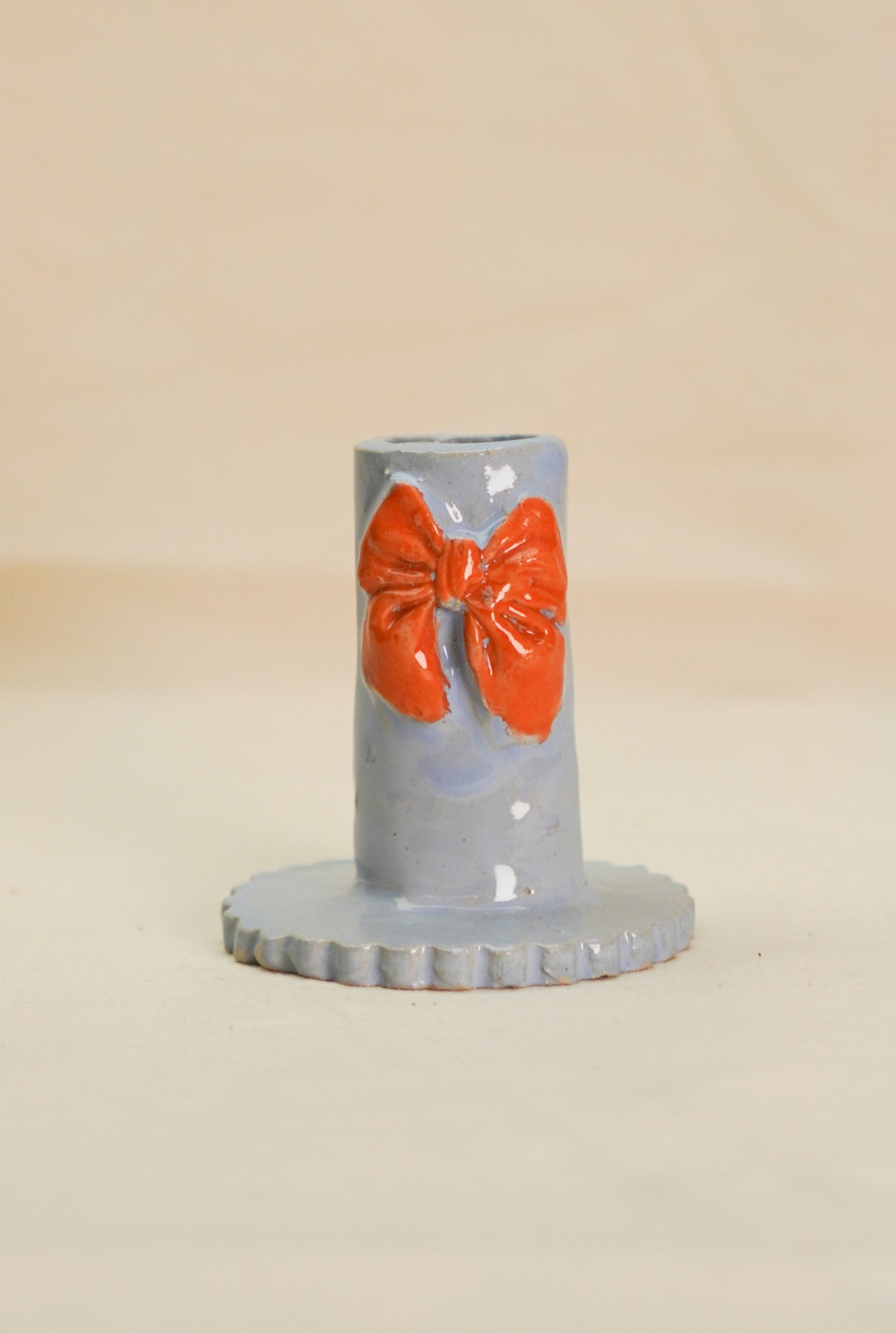 Świecznki niebieski z pomarańczową kokardą 